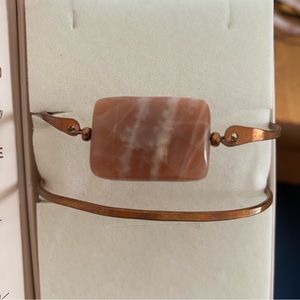 Copper cuff bracelet with stone.